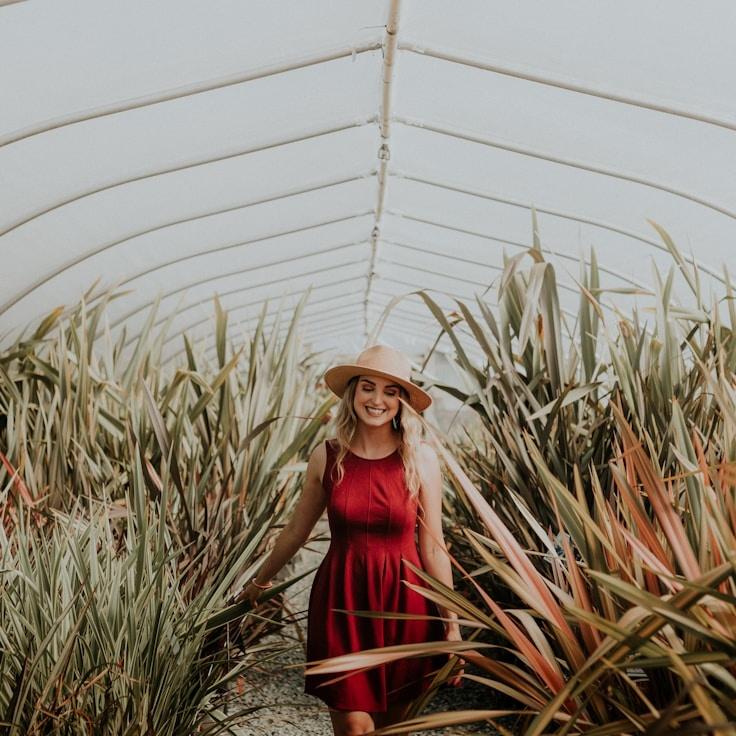 Kaveri Mehta, Lead Design Curator at Juniper Meadow Mingle, reviewing corporate floral arrangements